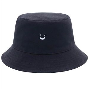 Reversible black smile bucket hat